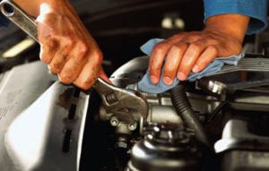 Mechanic fixing engine.