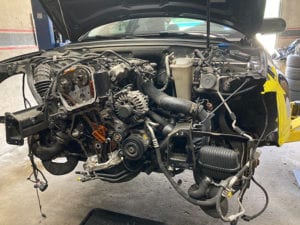 Car motor being worked on.