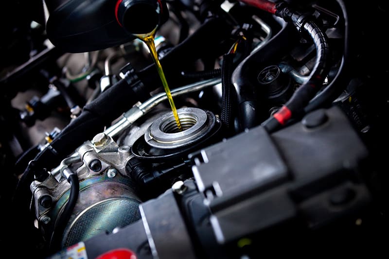 Oil-Change Finishing an oil change by adding new oil
